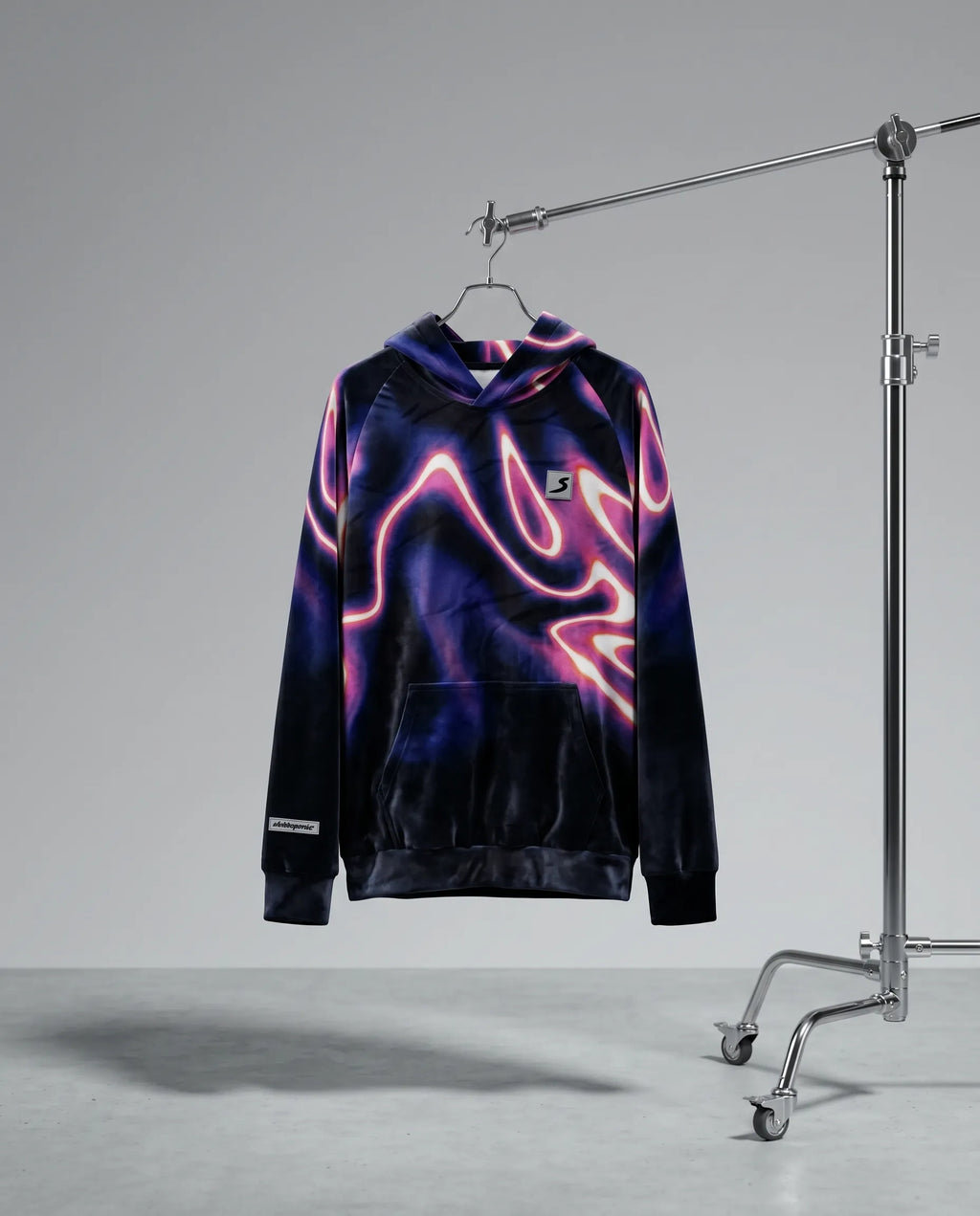 Neon pink and purple flame-patterned hoodie on a hanger against a gray background